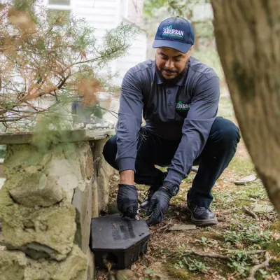 technician outside bait station rodent control