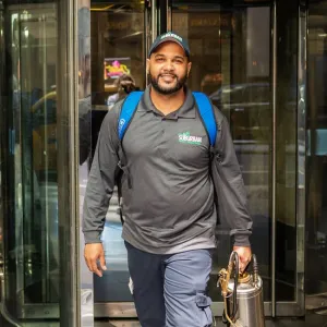 technician walking out of commercial building
