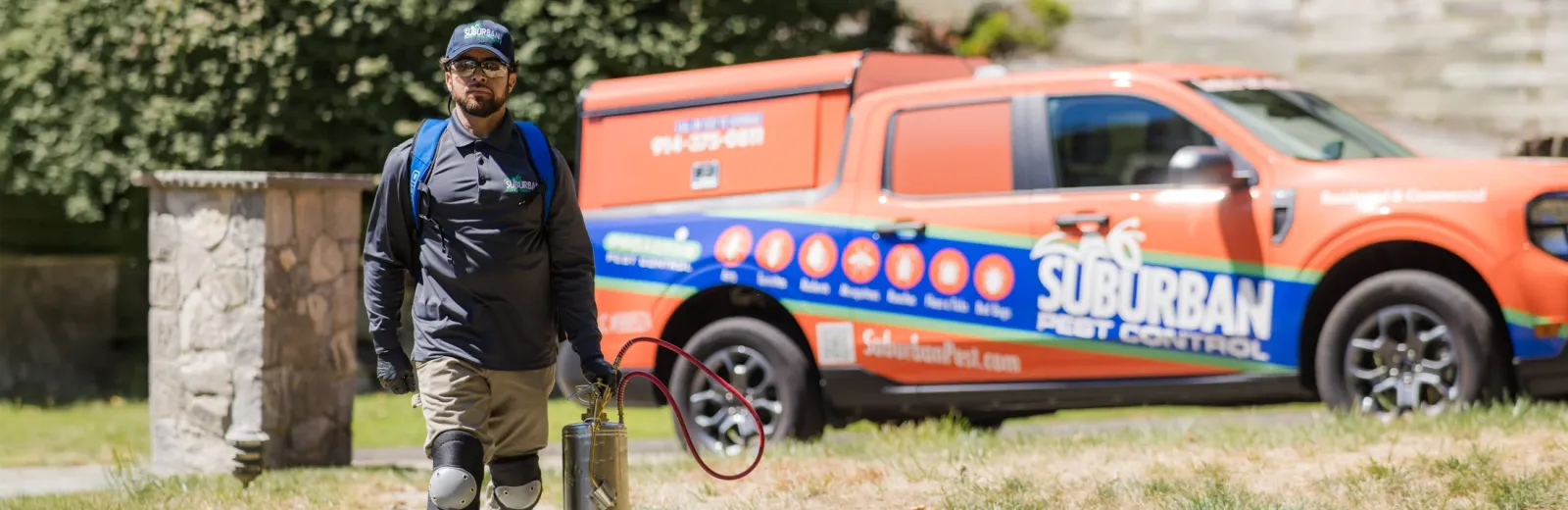 technician outside company vehicle truck in background