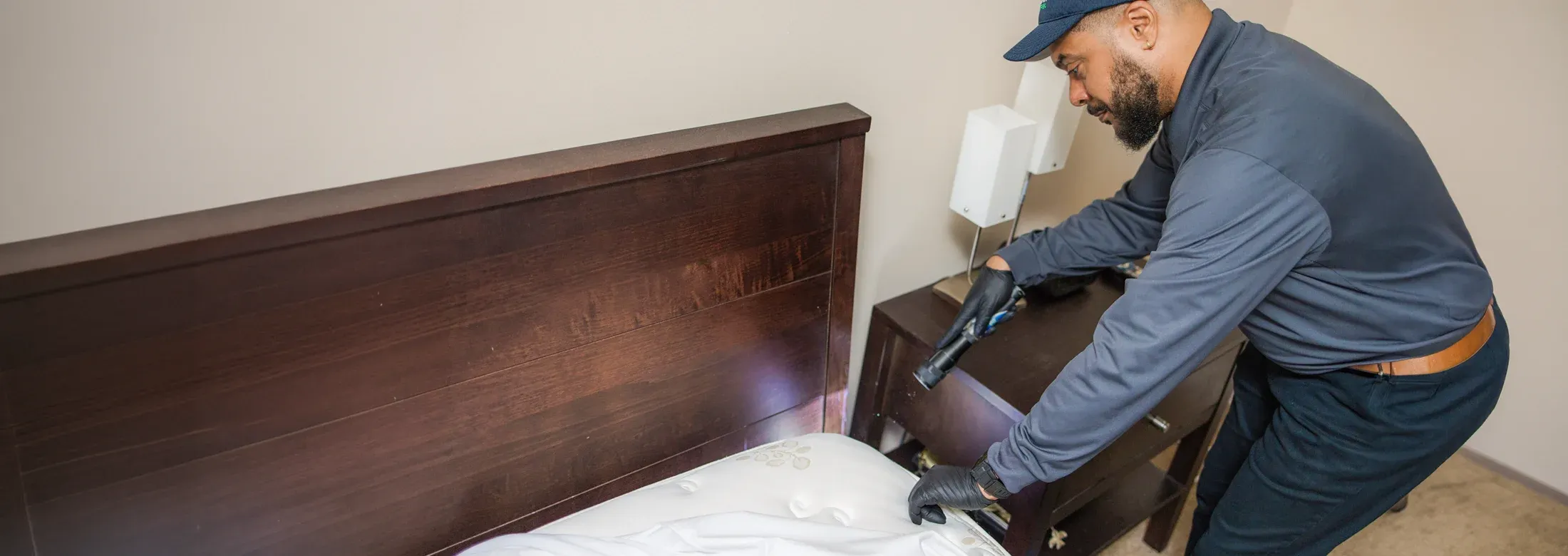 technician inspecting bed