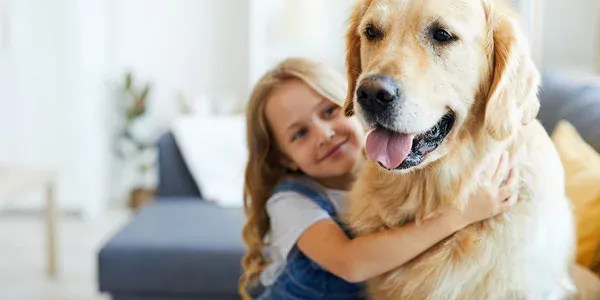 girl playing with dog